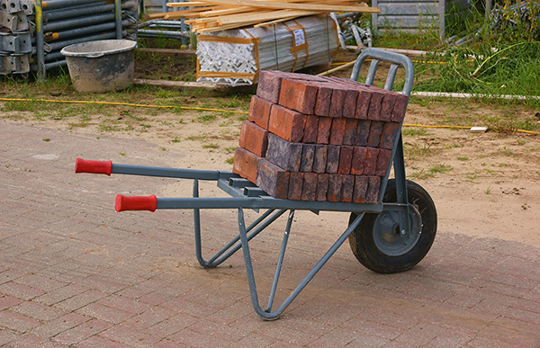 Moving bricks using a Brick Barrow is a hazardous manual task.