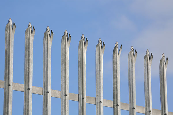 Environmental factors such as adverse weather can impact the safety of fencing work.
