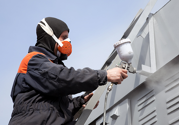 Maintaining safety during spray painting requires the application of protective gear and proper equipment handling.