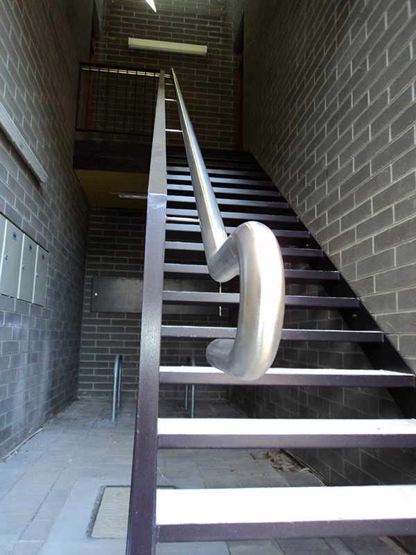 A structural steel staircase offers durable and robust access between different levels of a building.