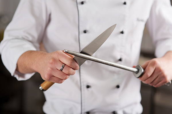 Using Knifes in a kitchen pose a risk of cuts and lacerations.