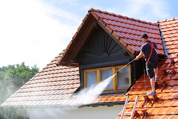 Cleaning roofs poses risks; ensure safety by wearing proper PPE!