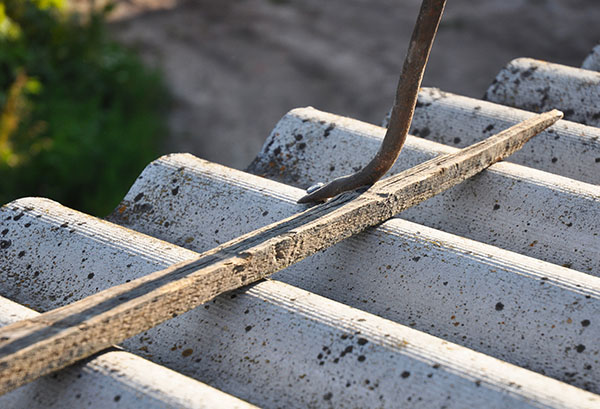 Carefully Remove Asbestos to not break and create dust.